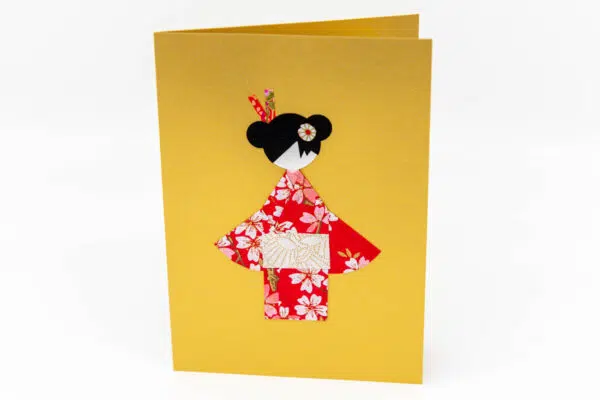 Carte geisha rouge sur fond or